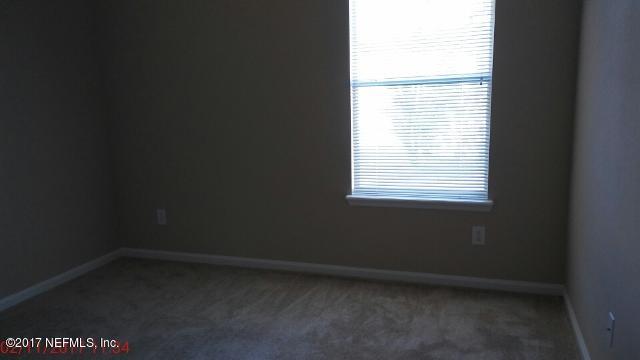 3421 South Saxxon Road St. Augustine, FL 32092 - Photo 5 of 13 a view of an empty room with a window