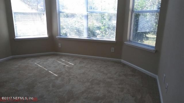 3421 South Saxxon Road St. Augustine, FL 32092 - Photo 9 of 13 a view of an empty room with a window
