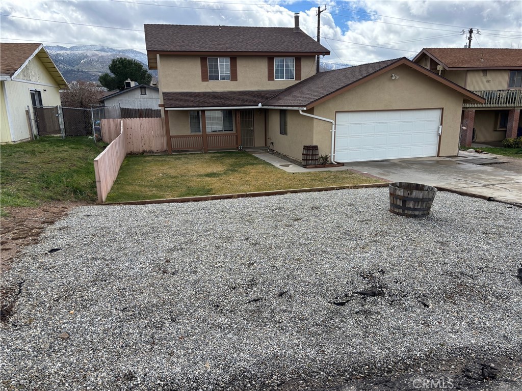 20416 Sierra Avenue Tehachapi, CA 93561 - Photo 1 of 1 a front view of a house with a yard