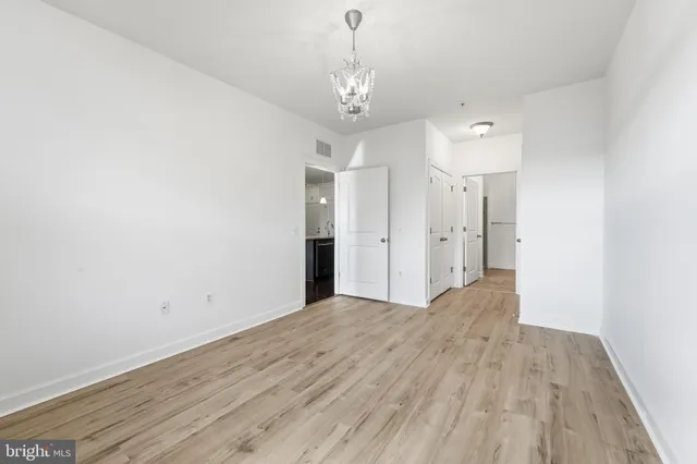 a bathroom with a granite countertop sink a toilet and a mirror