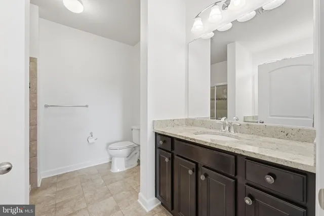 a bathroom with a shower and a sink