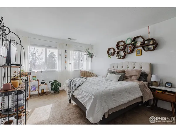 a bedroom with a bed and a table