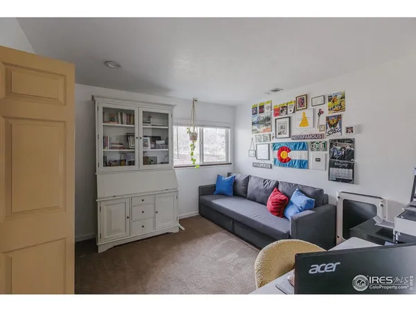a living room with furniture and window