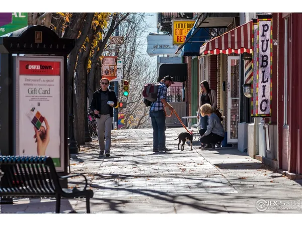 a view of a street with stores
