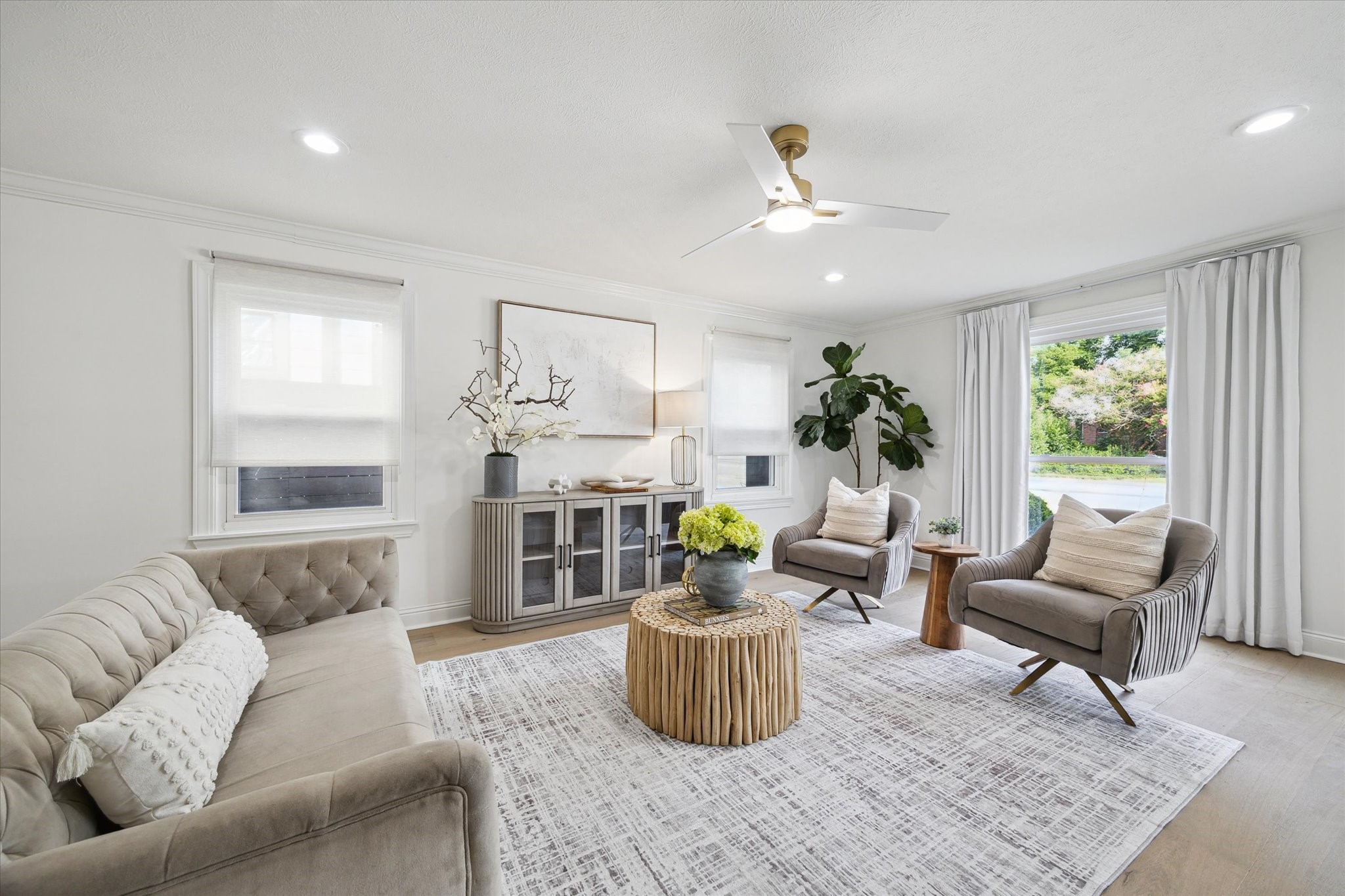 4148 Bissonnet Street West University Place, TX 77005 - Photo 11 of 39 a living room with furniture and a fireplace