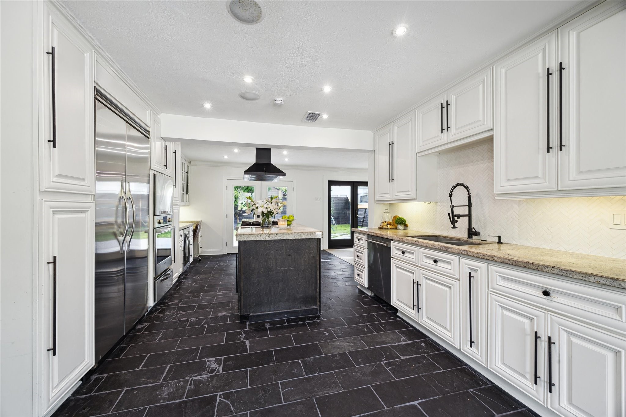 4148 Bissonnet Street West University Place, TX 77005 - Photo 14 of 39 a kitchen with sink cabinets and window