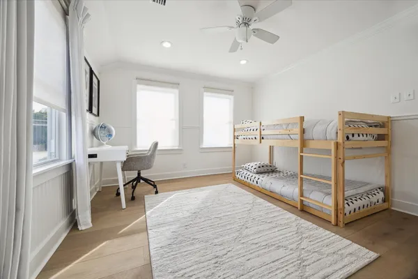 a bedroom with furniture and a window