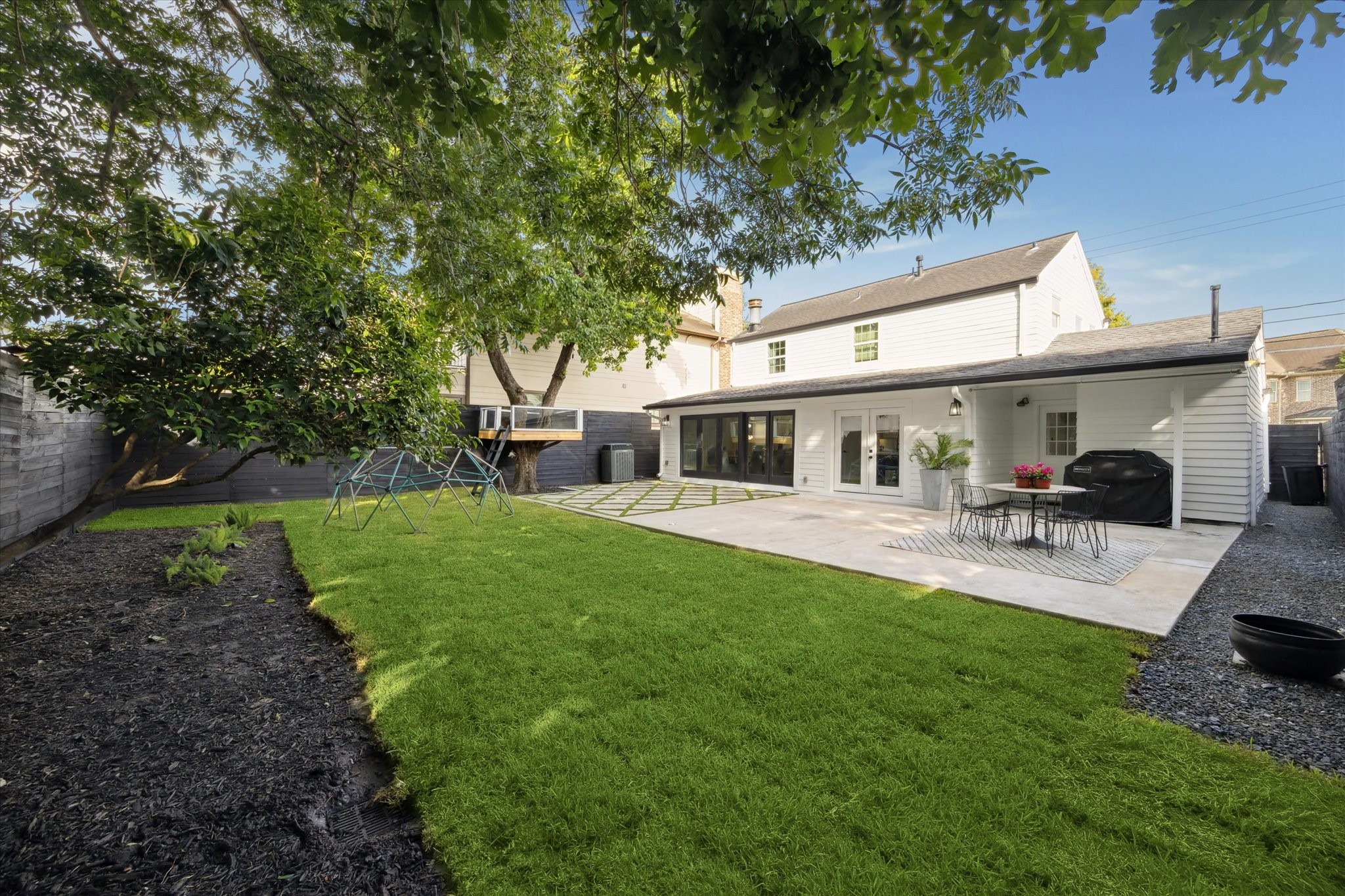 4148 Bissonnet Street West University Place, TX 77005 - Photo 29 of 39 a front view of a house with yard patio and green space