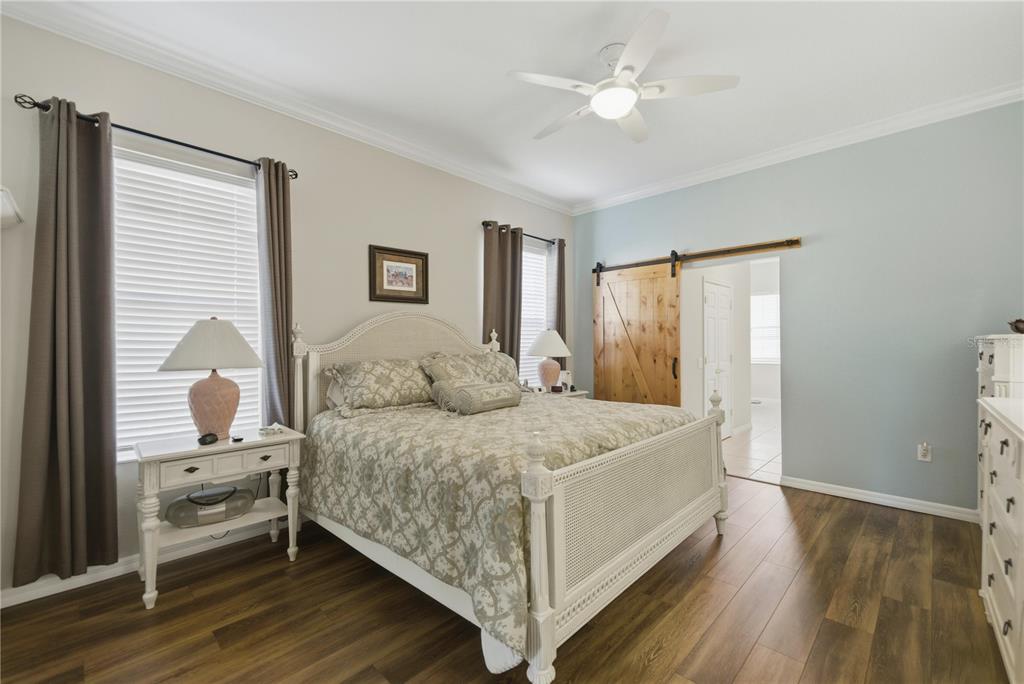 8821 Southwest 82nd Court Road Ocala, FL 34481 - Photo 13 of 32 a spacious bedroom with a bed and a window