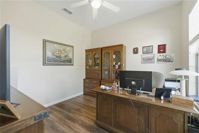 a view of a workspace with furniture and chandelier