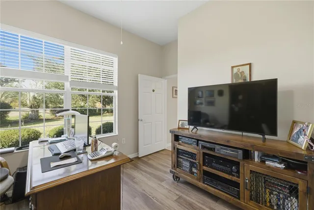 a room with furniture and flat screen tv