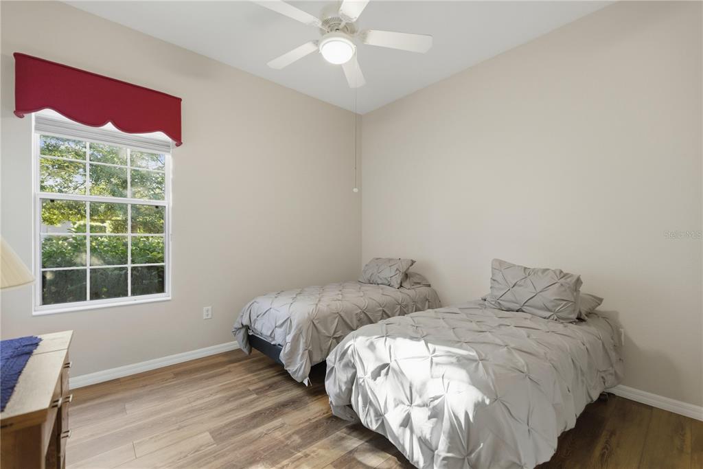 8821 Southwest 82nd Court Road Ocala, FL 34481 - Photo 20 of 32 a bed room with two bed and a window