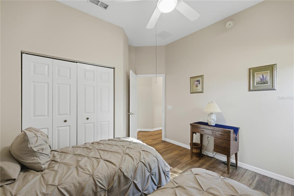 8821 Southwest 82nd Court Road Ocala, FL 34481 - Photo 21 of 32 a bedroom with a bed and a chair