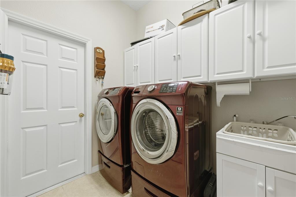 8821 Southwest 82nd Court Road Ocala, FL 34481 - Photo 25 of 32 a utility room with dryer and washer