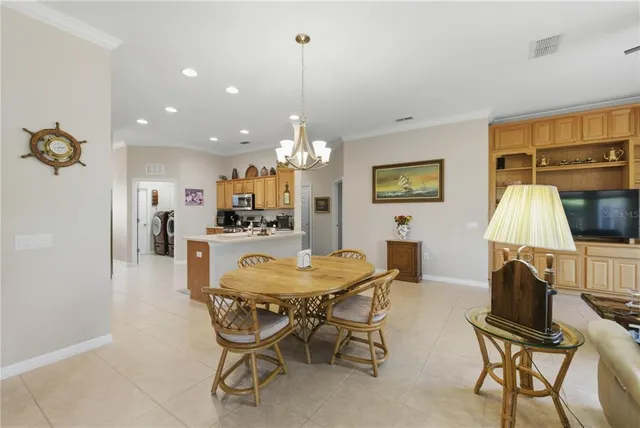 a dining room with furniture and window