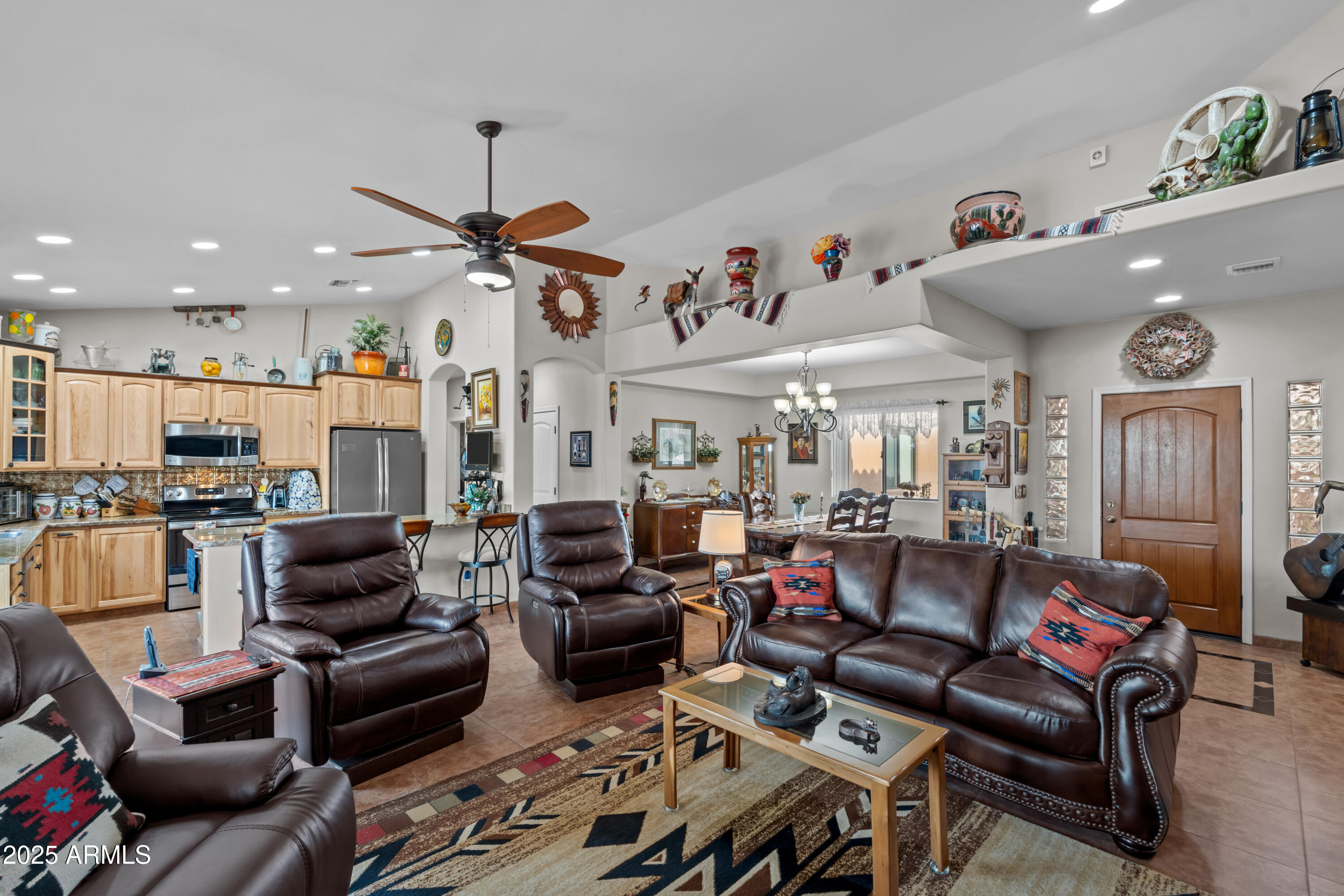 608 Paseo Reforma Rio Rico, AZ 85648 - Photo 12 of 50 a living room with furniture and a chandelier