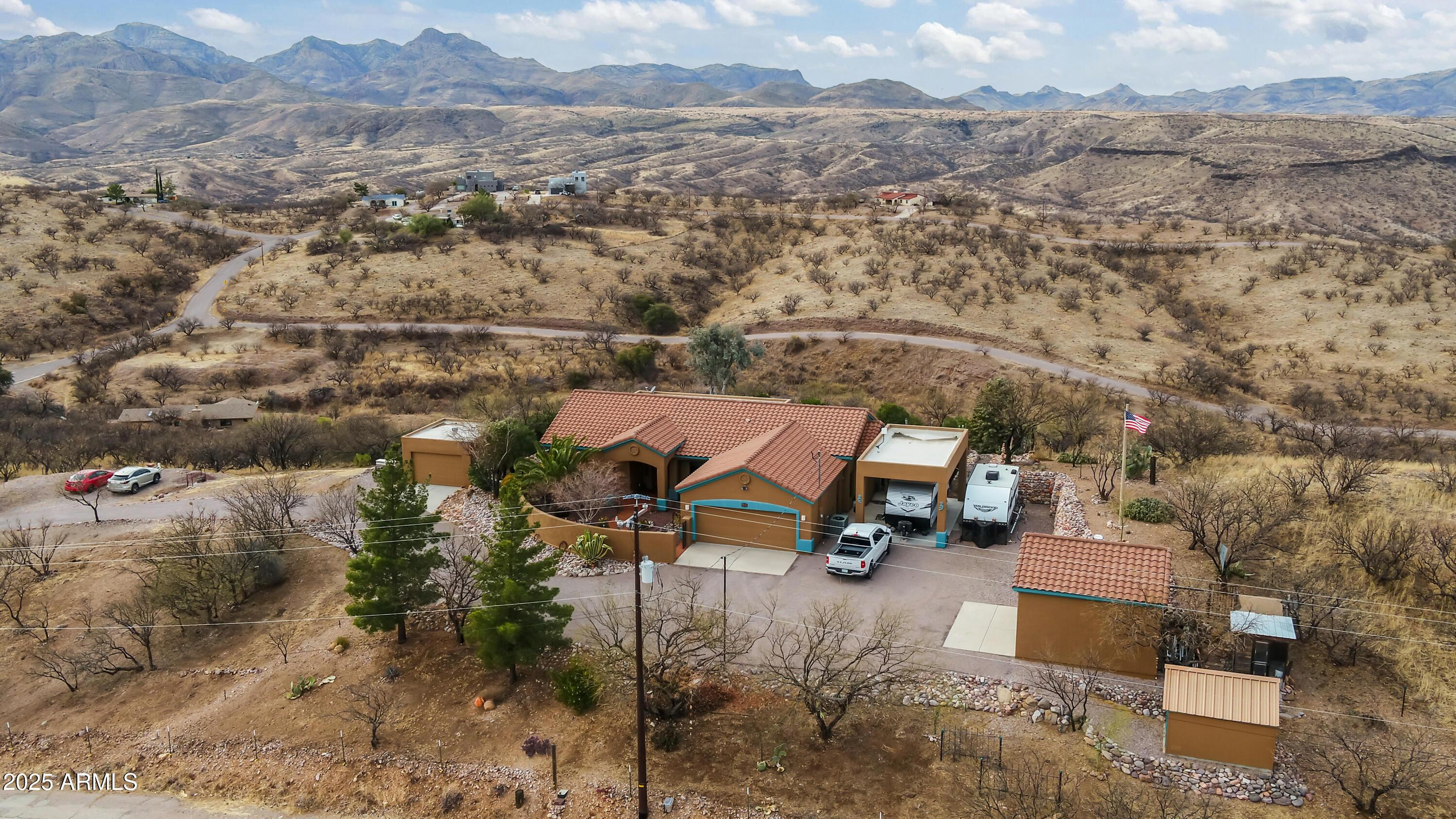 608 Paseo Reforma Rio Rico, AZ 85648 - Photo 2 of 50 an aerial view of a house with a mountain