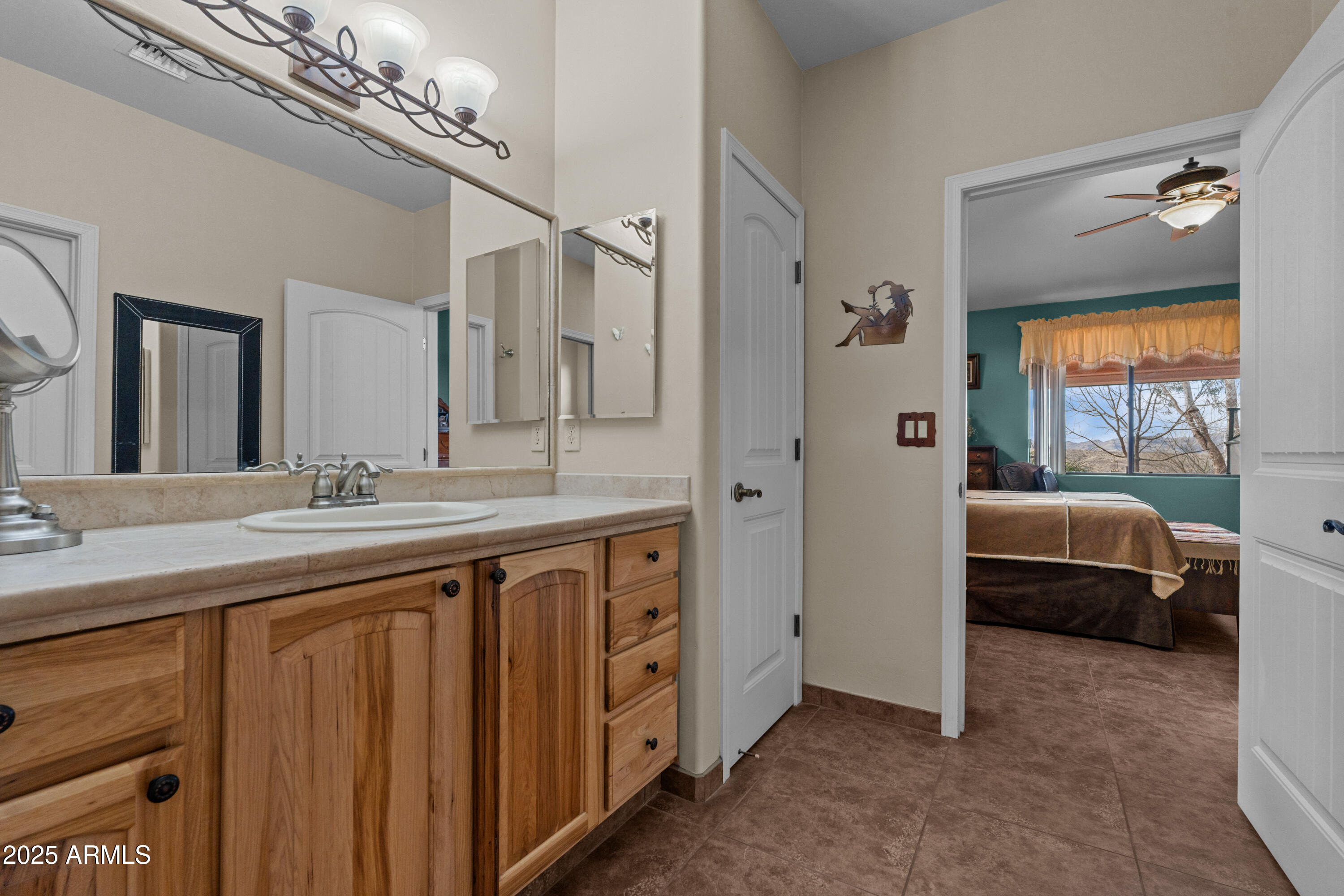 608 Paseo Reforma Rio Rico, AZ 85648 - Photo 21 of 50 a spacious bathroom with a double vanity sink a mirror and a shower
