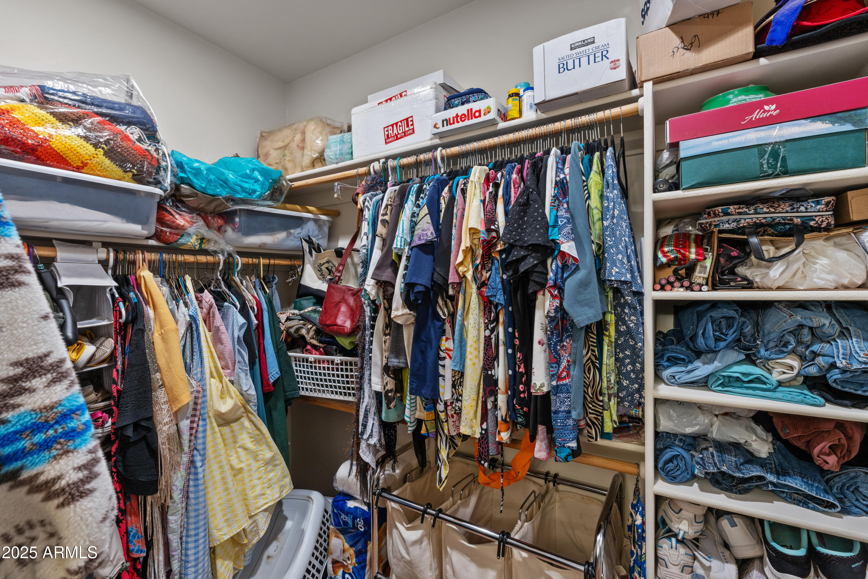 608 Paseo Reforma Rio Rico, AZ 85648 - Photo 24 of 50 a view of walk in closet with clothes and shoes