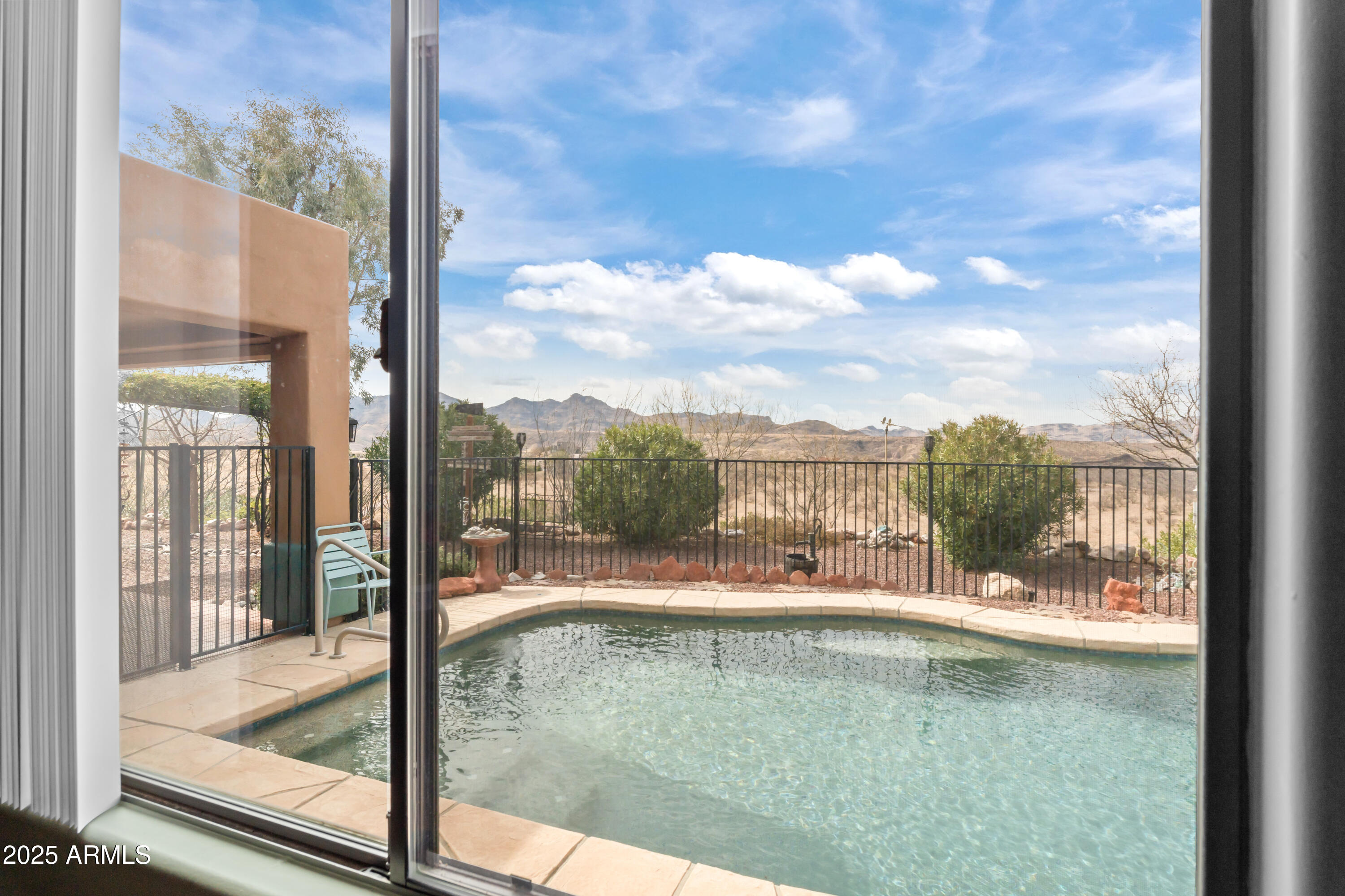 608 Paseo Reforma Rio Rico, AZ 85648 - Photo 27 of 50 a view of a lake from a window