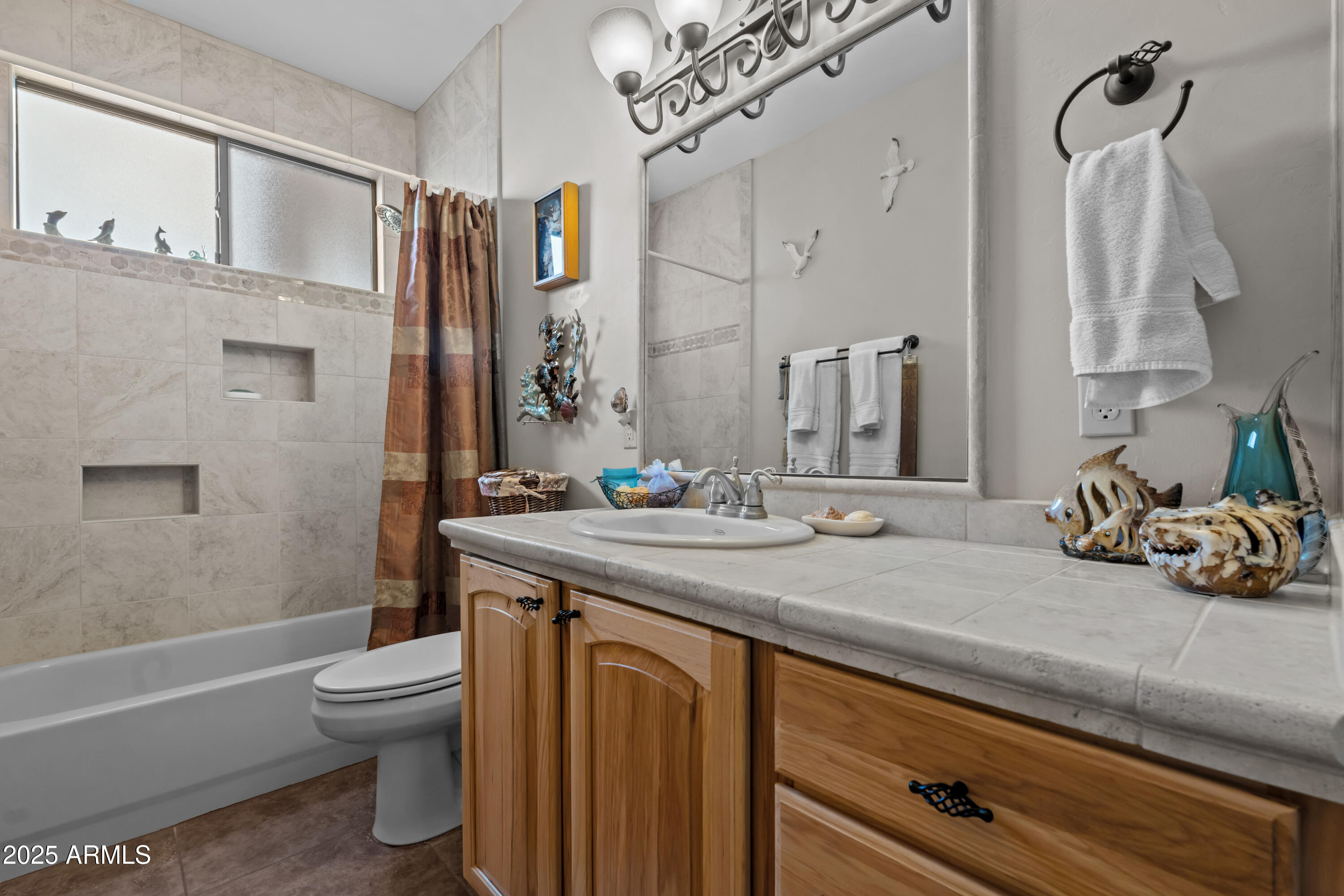 608 Paseo Reforma Rio Rico, AZ 85648 - Photo 28 of 50 a bathroom with a sink a toilet and shower