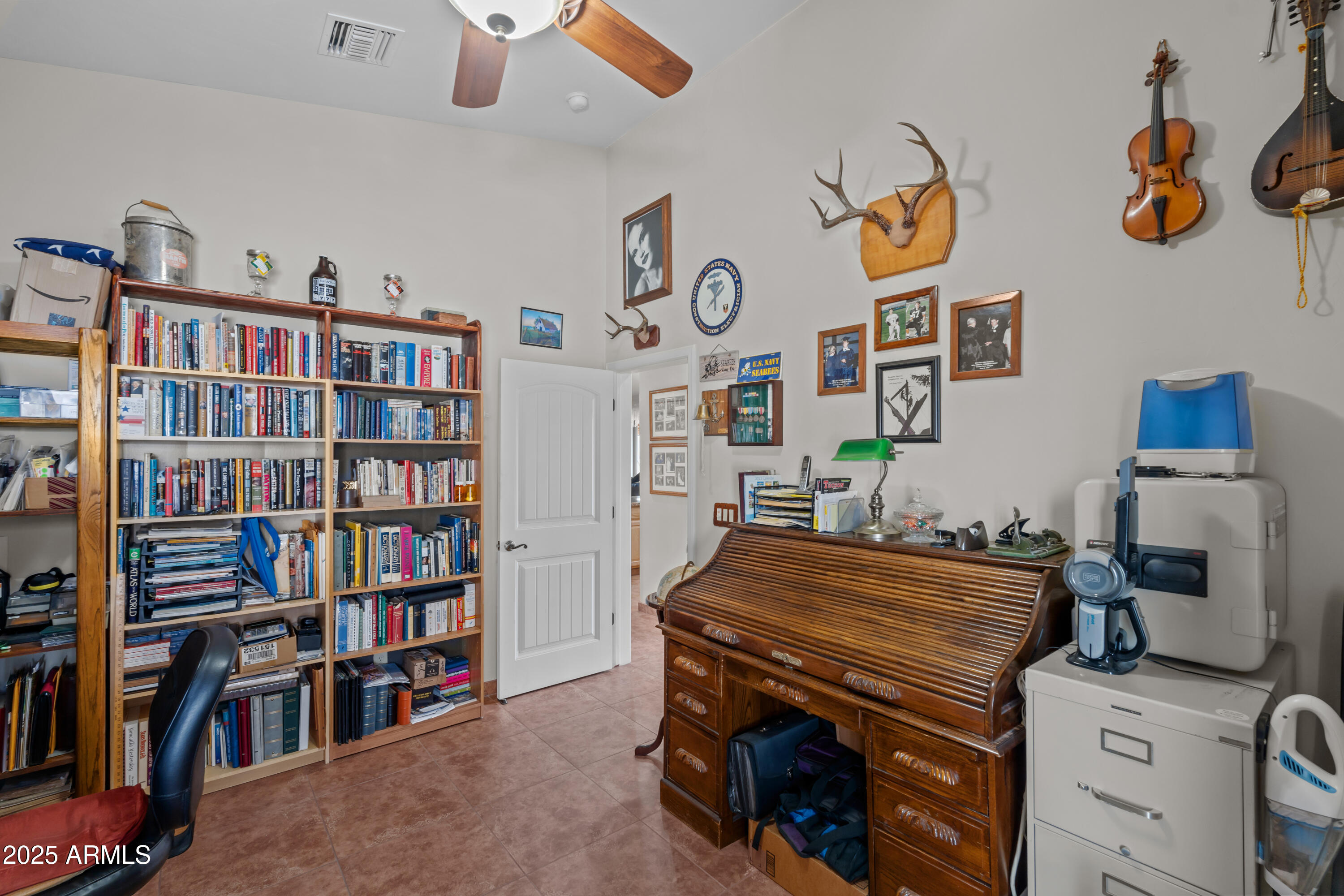 608 Paseo Reforma Rio Rico, AZ 85648 - Photo 30 of 50 a bedroom with a bed and book shelf