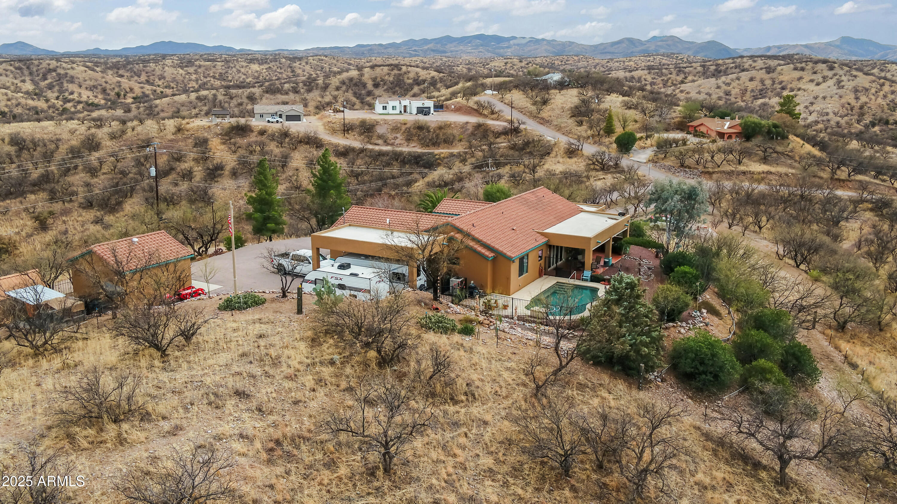 608 Paseo Reforma Rio Rico, AZ 85648 - Photo 3 of 50 an aerial view of a house with a yard