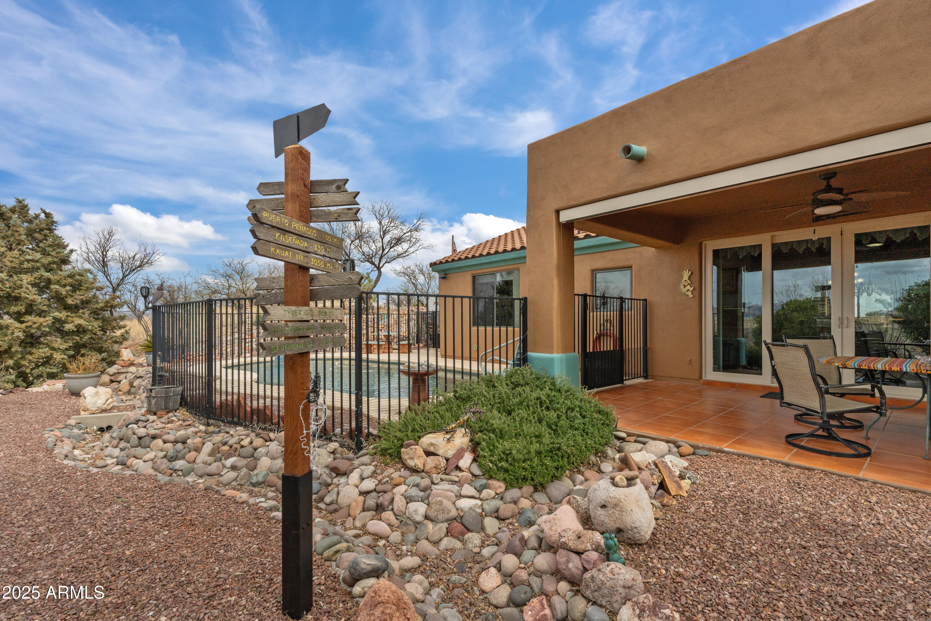 608 Paseo Reforma Rio Rico, AZ 85648 - Photo 32 of 50 a front view of a building with a bench