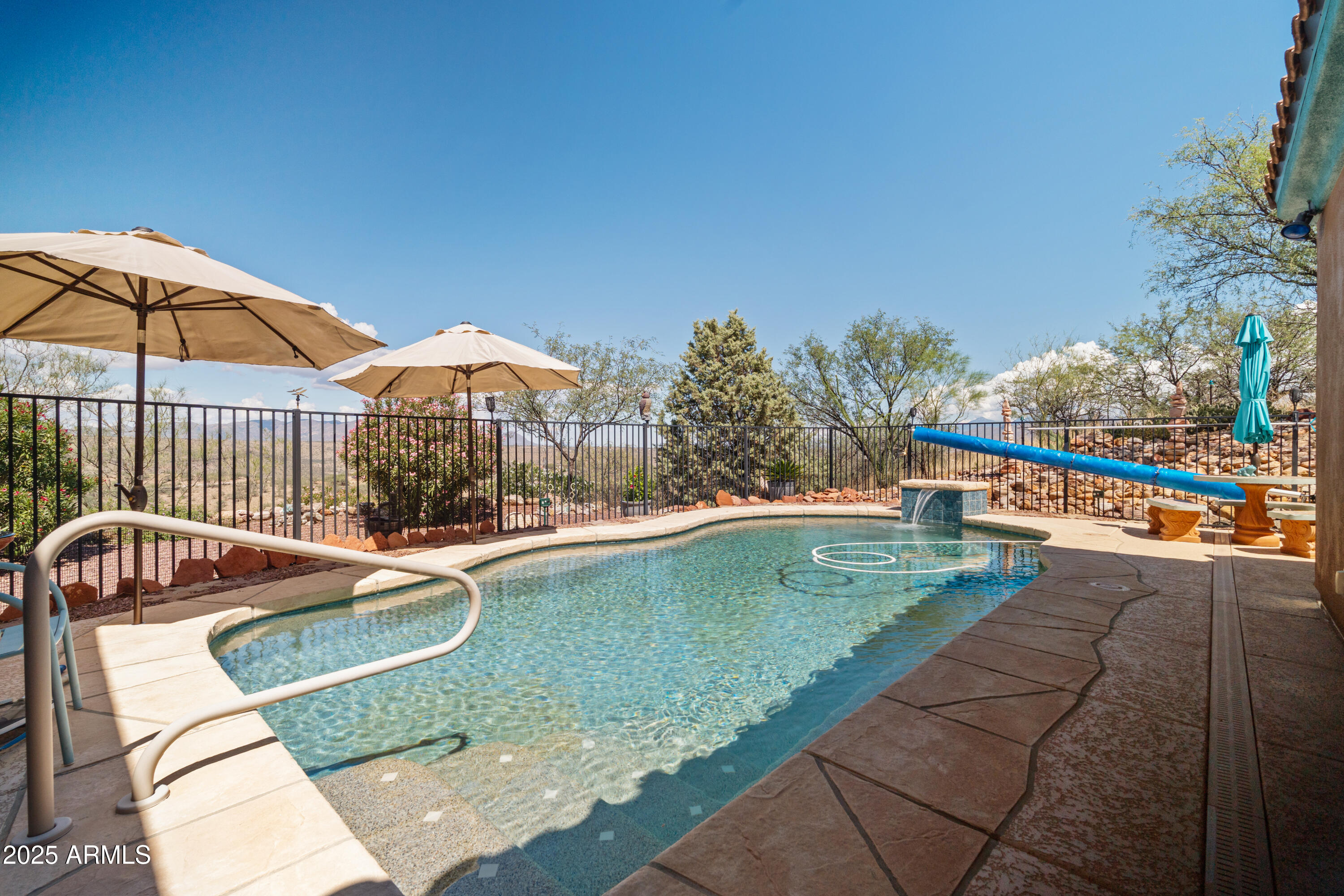 608 Paseo Reforma Rio Rico, AZ 85648 - Photo 36 of 50 a view of a swimming pool with a lounge chairs