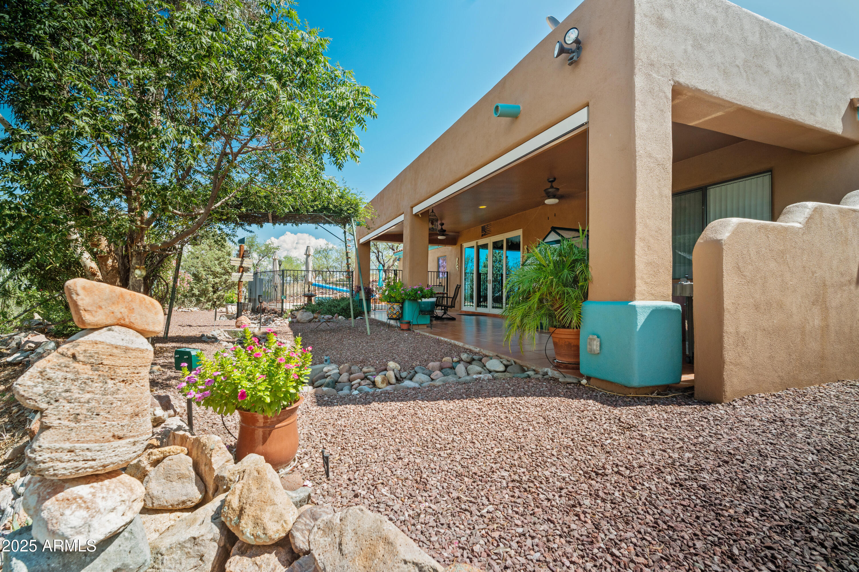 608 Paseo Reforma Rio Rico, AZ 85648 - Photo 39 of 50 a view of a chairs and bench in the backyard