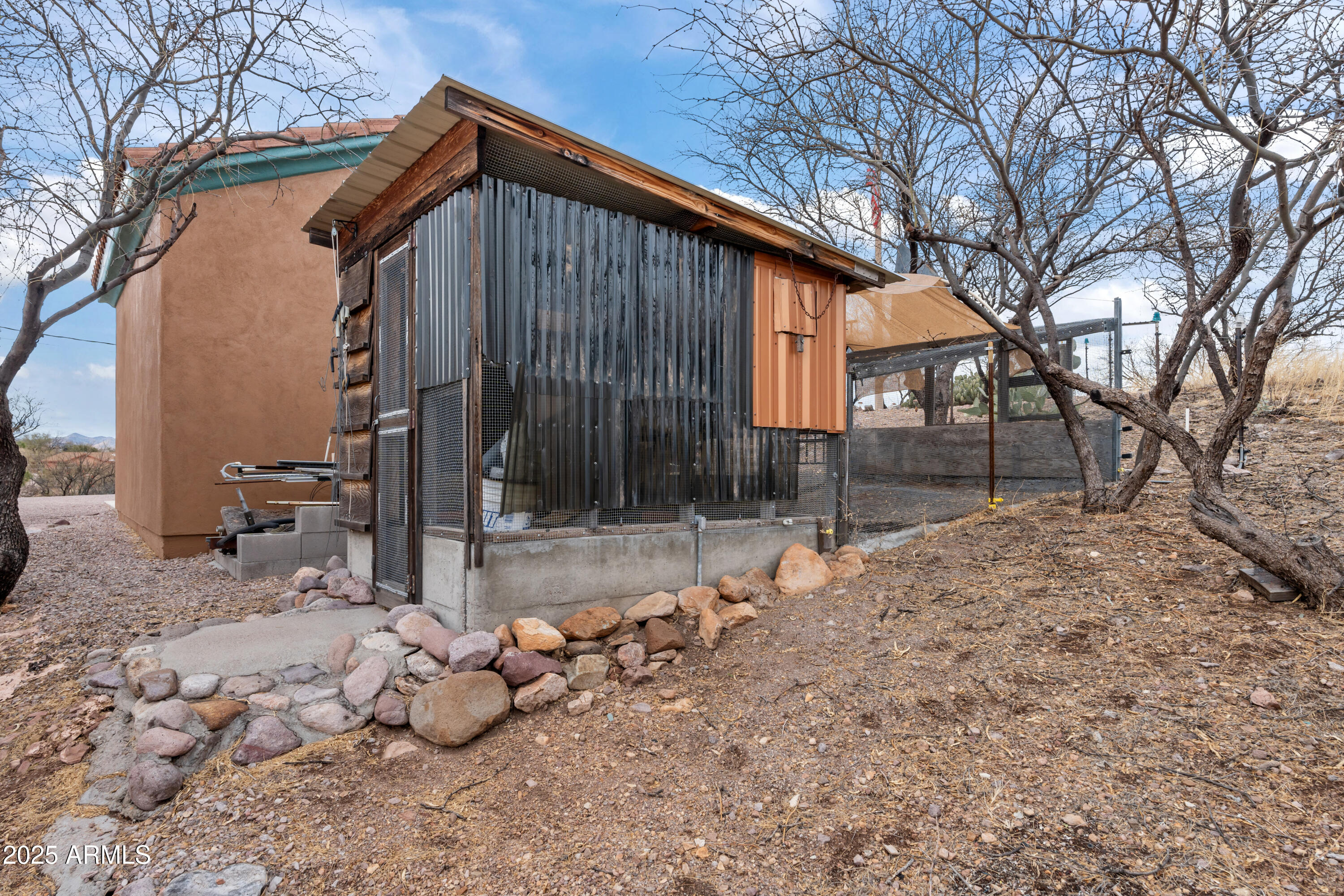 608 Paseo Reforma Rio Rico, AZ 85648 - Photo 47 of 50 a backyard of a house with table and chairs