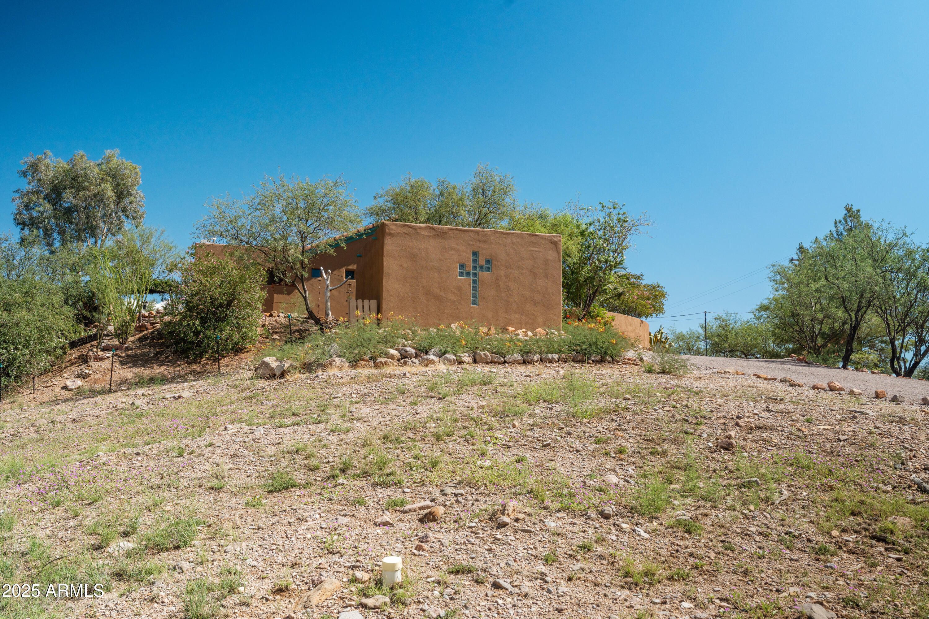 608 Paseo Reforma Rio Rico, AZ 85648 - Photo 49 of 50 a backyard of a house with large trees
