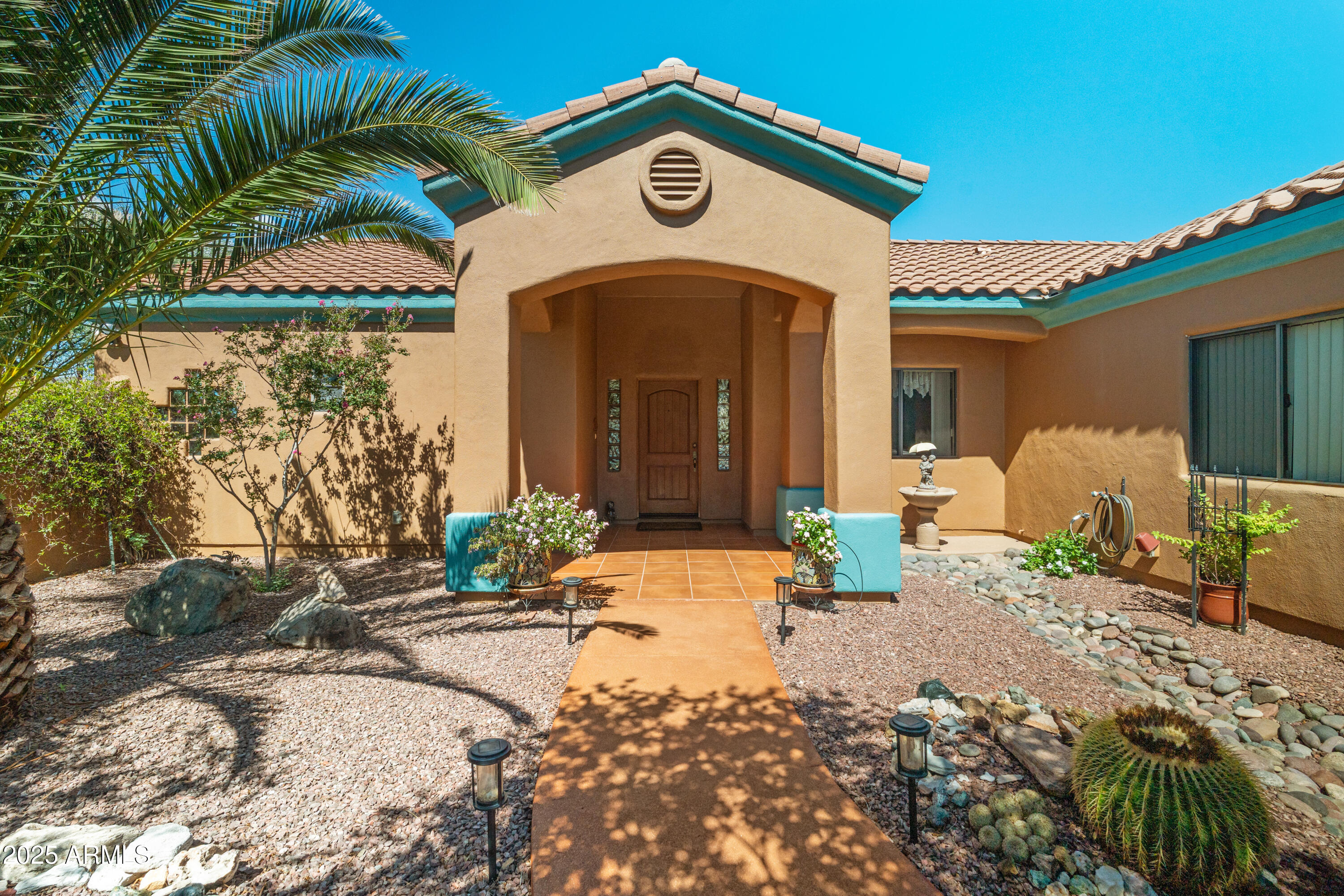 608 Paseo Reforma Rio Rico, AZ 85648 - Photo 10 of 50 a front view of a house with a yard