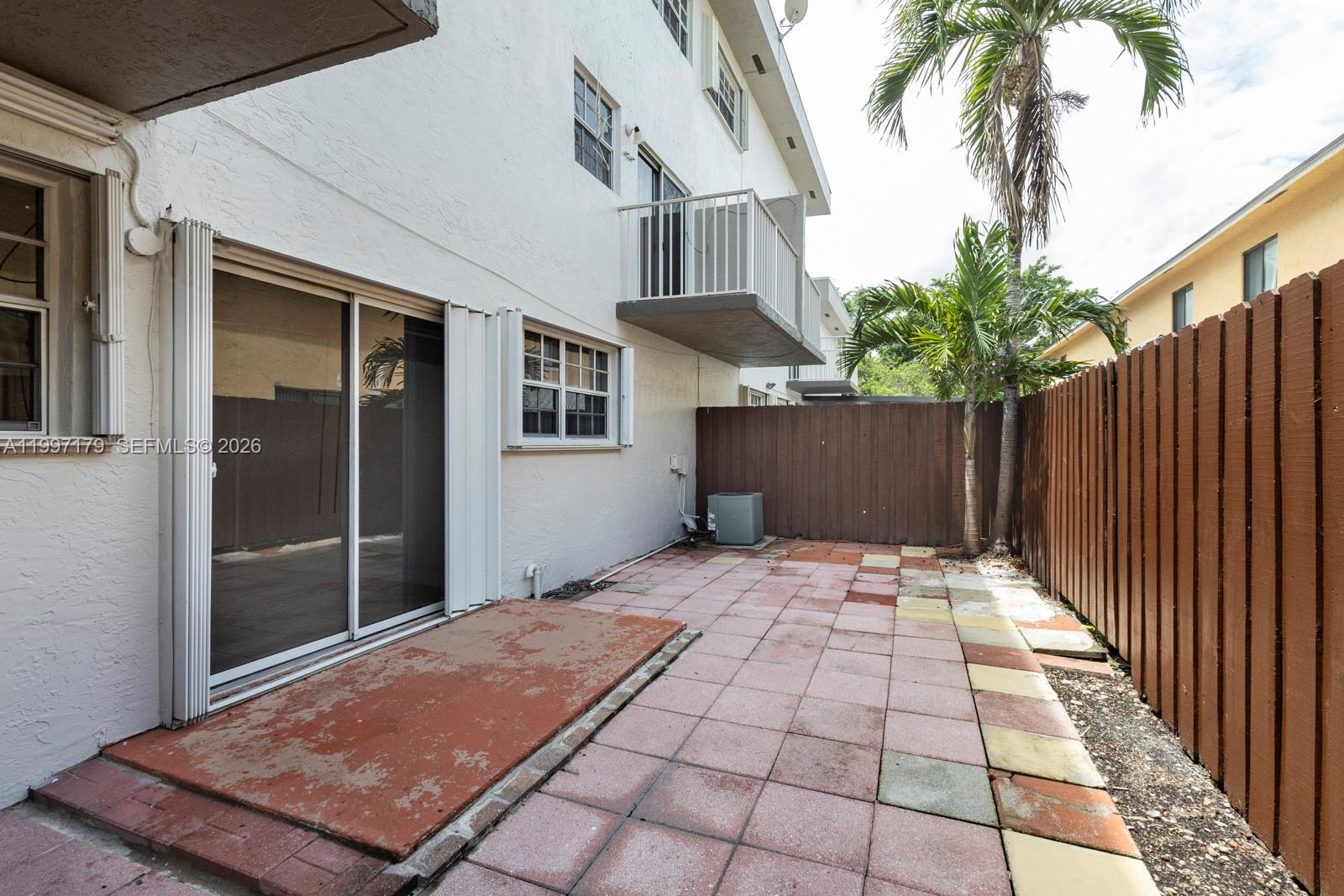 7510 Southwest 152nd Avenue, Unit C104 Miami, FL 33193 - Photo 13 of 14 a backyard of a house