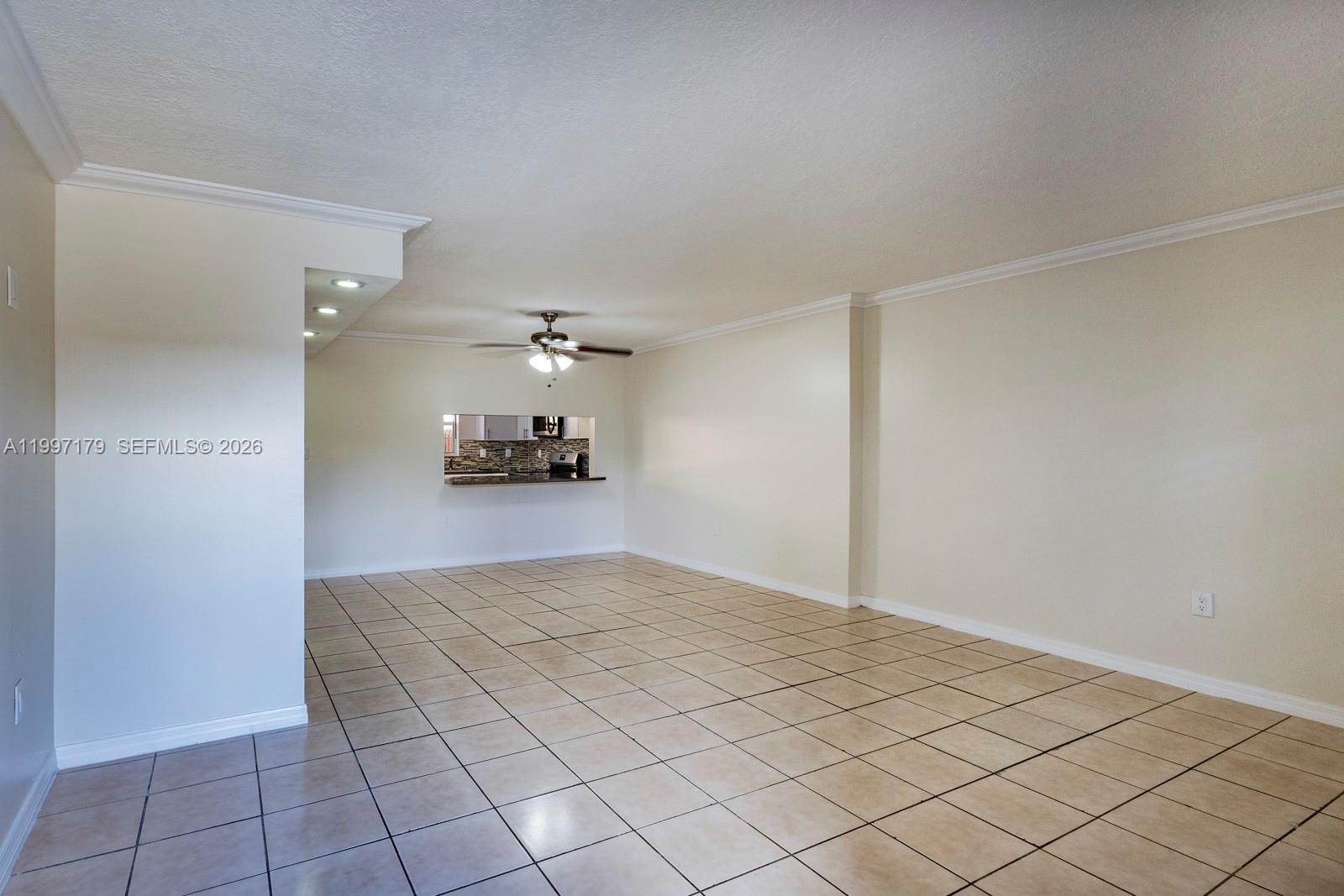 7510 Southwest 152nd Avenue, Unit C104 Miami, FL 33193 - Photo 2 of 14 a view of a livingroom and a chandelier fan