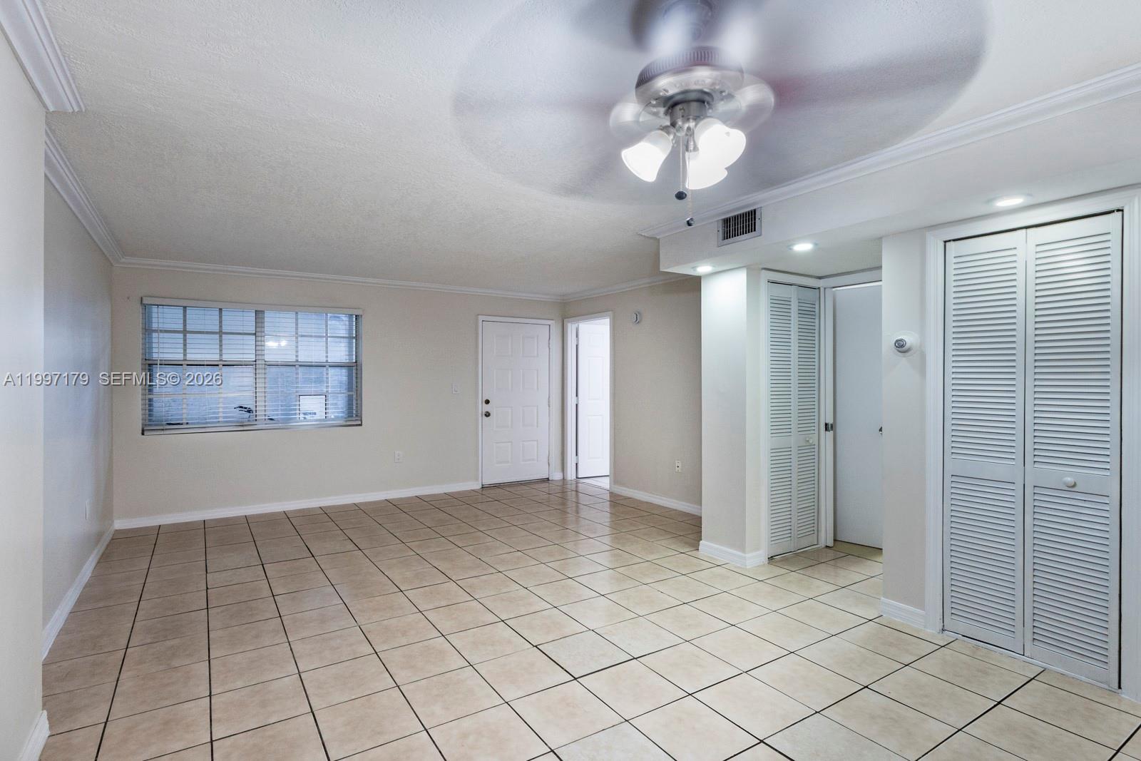 7510 Southwest 152nd Avenue, Unit C104 Miami, FL 33193 - Photo 5 of 14 a view of an empty room with a window
