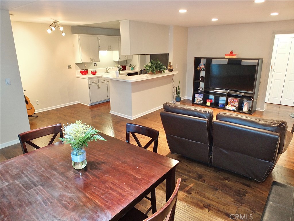 1770 Ximeno Avenue, Unit 314 Long Beach, CA 90815 - Photo 16 of 37 a room with furniture and a flat screen tv