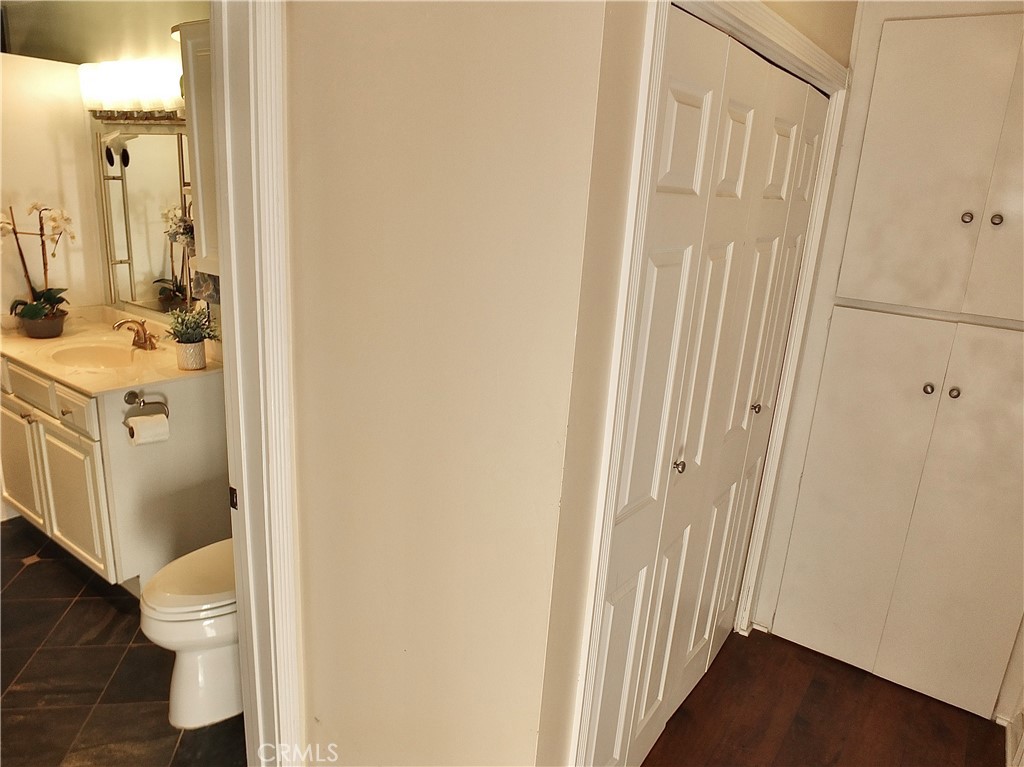 1770 Ximeno Avenue, Unit 314 Long Beach, CA 90815 - Photo 21 of 37 a bathroom with a sink a toilet and shower