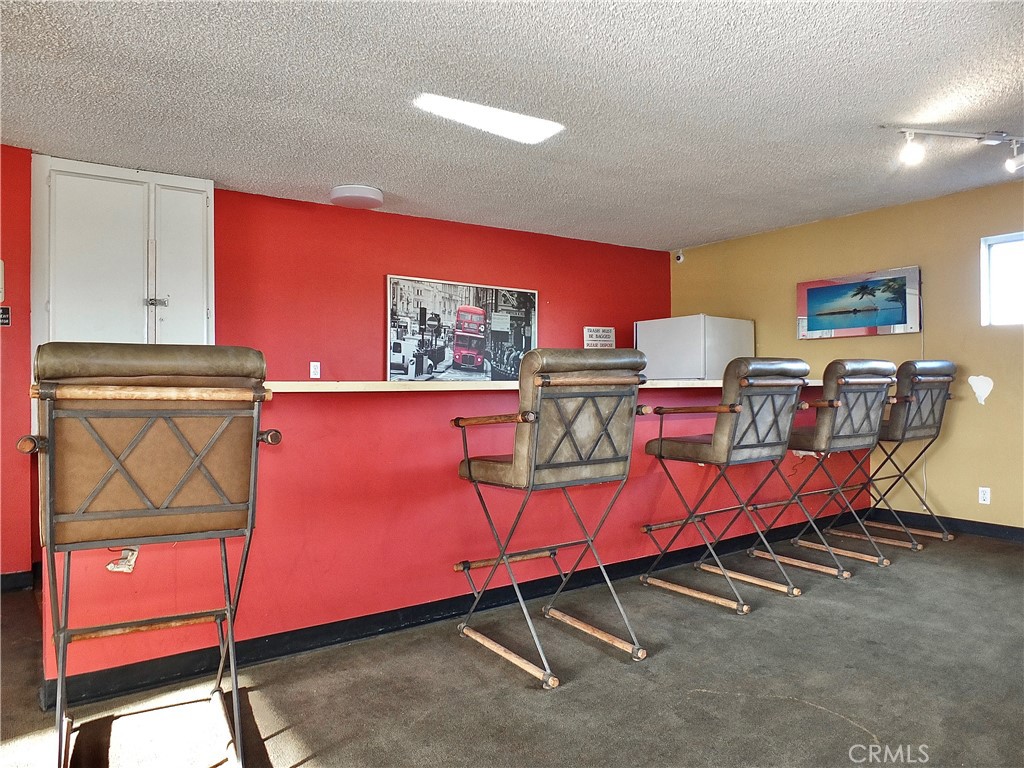 1770 Ximeno Avenue, Unit 314 Long Beach, CA 90815 - Photo 28 of 37 a living room with furniture