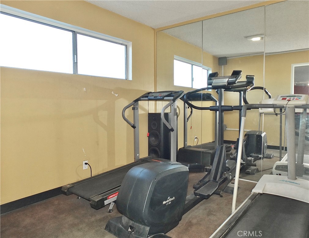1770 Ximeno Avenue, Unit 314 Long Beach, CA 90815 - Photo 32 of 37 a room with gym equipment