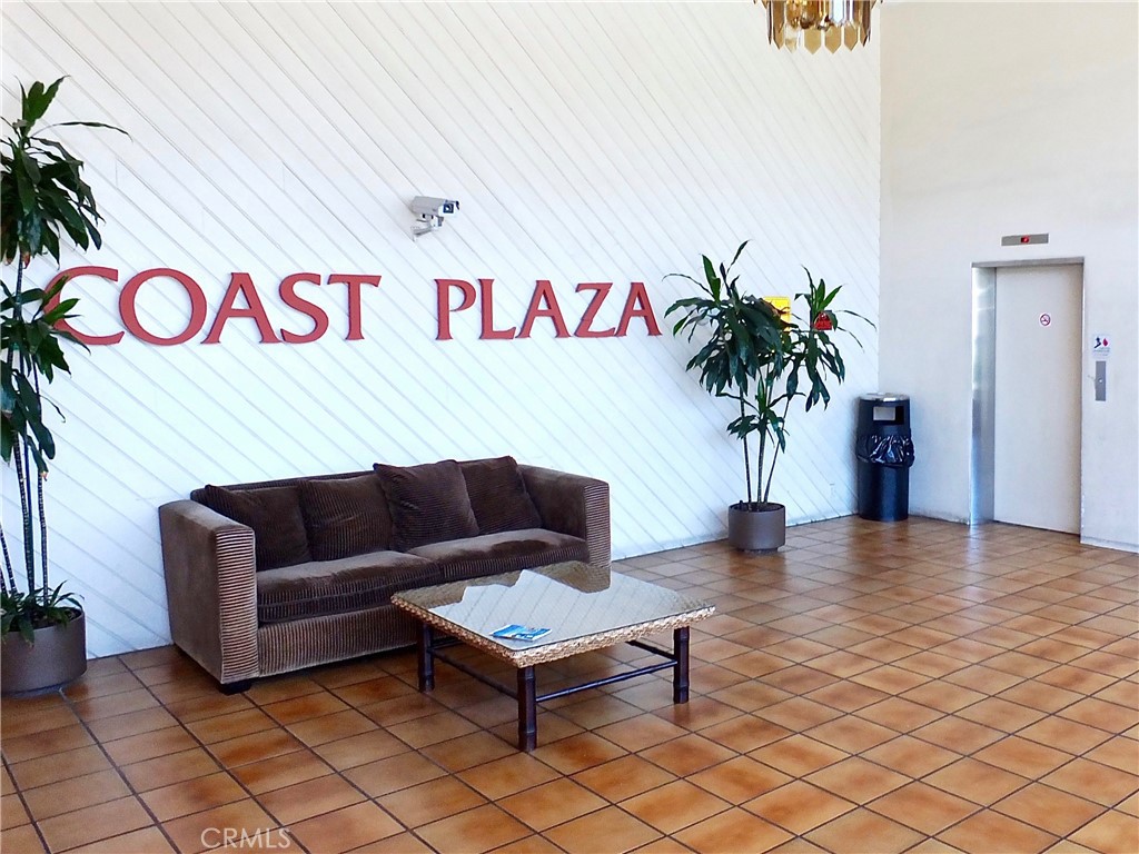1770 Ximeno Avenue, Unit 314 Long Beach, CA 90815 - Photo 35 of 37 a living room with furniture and a potted plant
