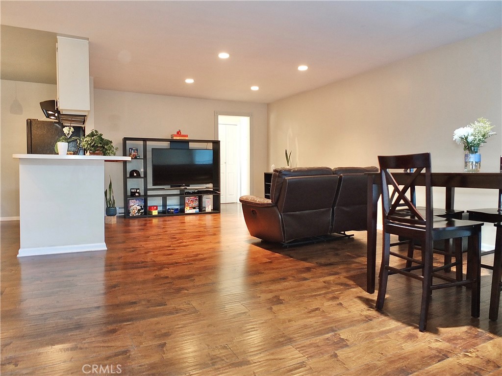 1770 Ximeno Avenue, Unit 314 Long Beach, CA 90815 - Photo 6 of 37 a living room with furniture and a flat screen tv