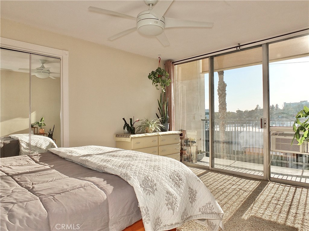 1770 Ximeno Avenue, Unit 314 Long Beach, CA 90815 - Photo 10 of 37 a bedroom with a large bed and a window