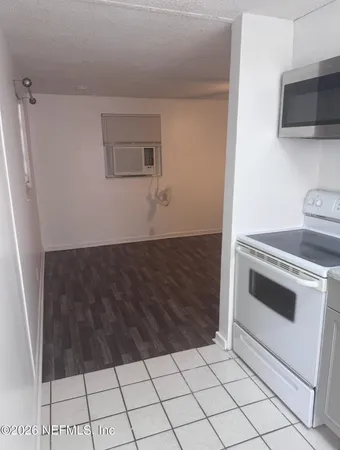 a white toilet sitting next to a window
