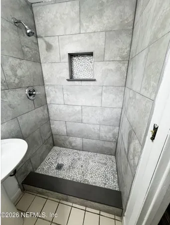 a view of room with wooden floor