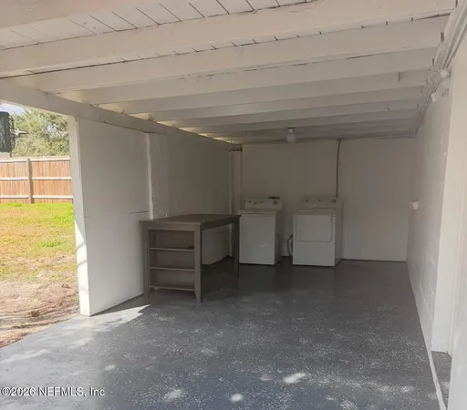 a kitchen with white cabinets stainless steel appliances and sink