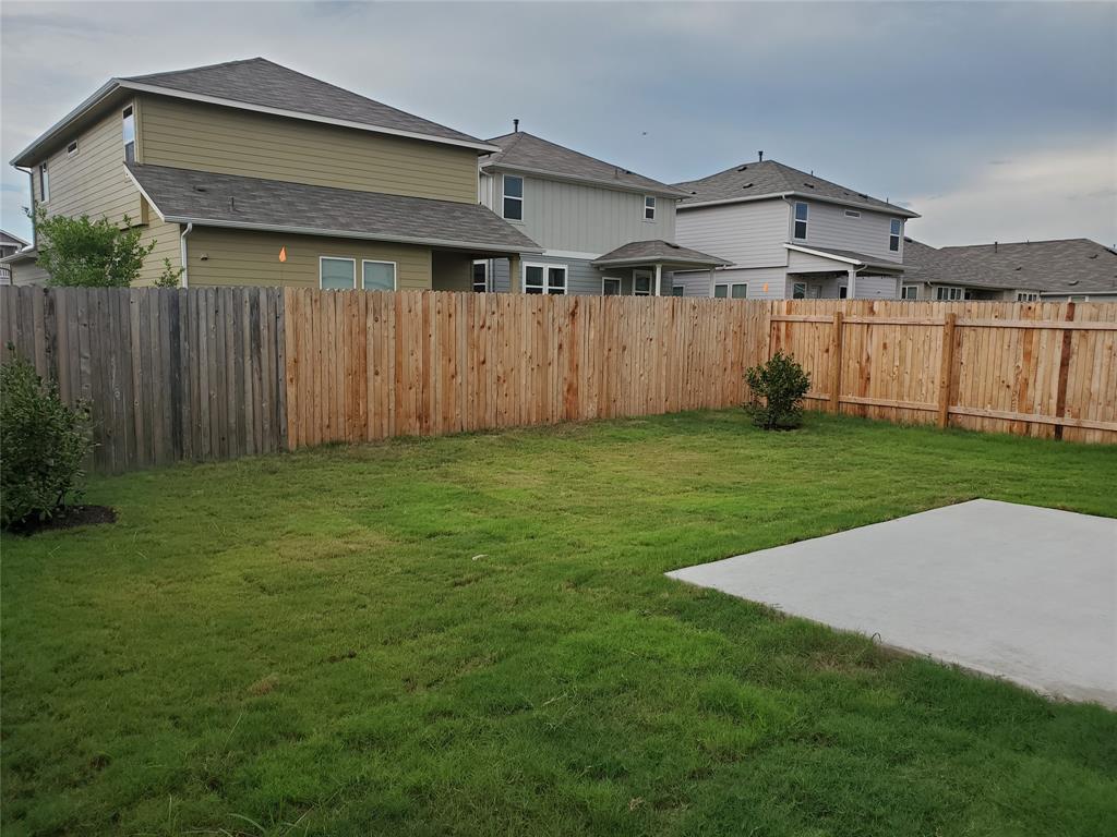 6404 Gunflint Drive Austin, TX 78747 - Photo 21 of 21 A spacious, enclosed backyard offers a private green oasis for leisure.