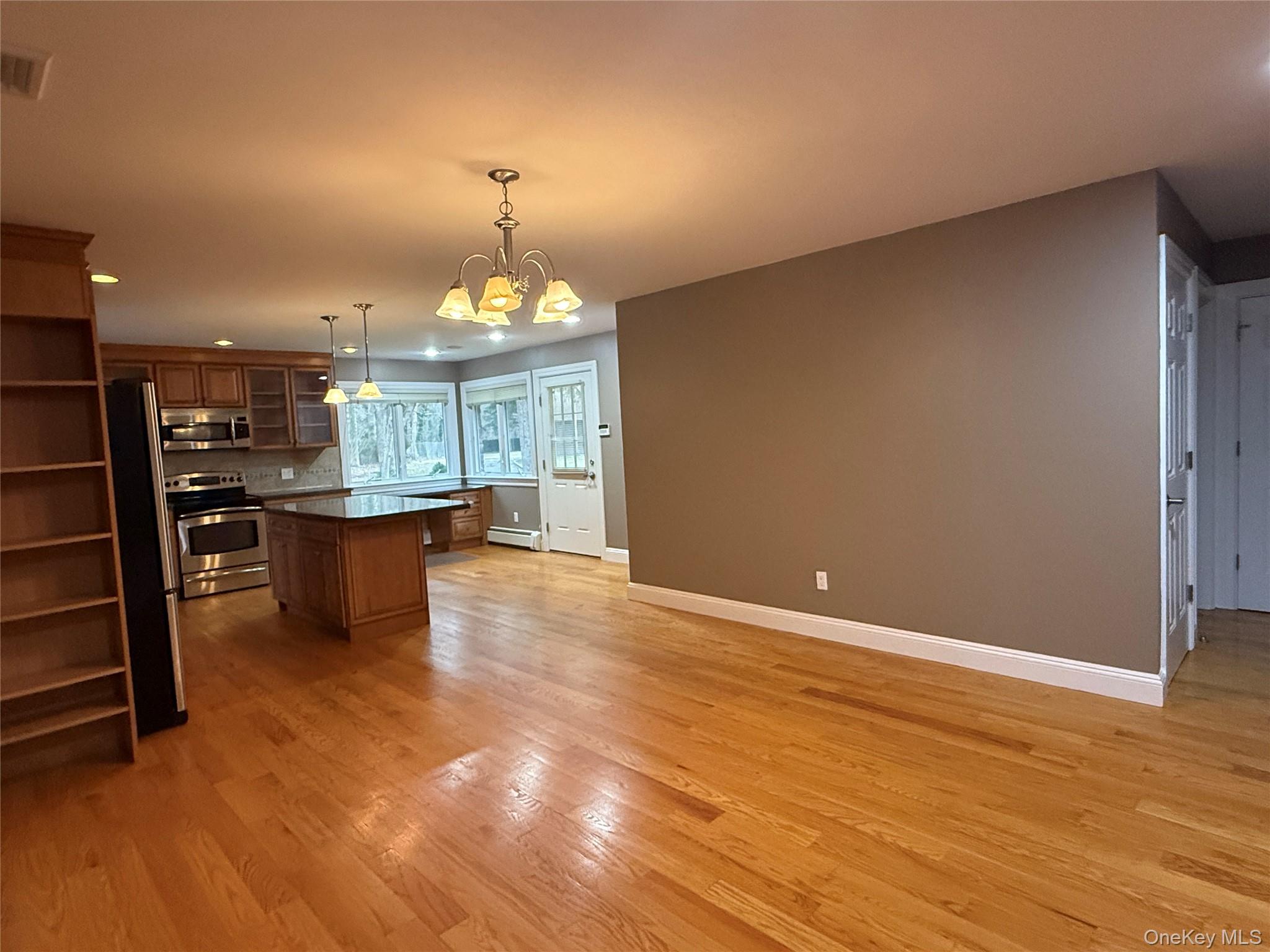 1926 Midlane Road Syosset, NY 11791 - Photo 20 of 21 a view of kitchen with granite countertop cabinets and refrigerator