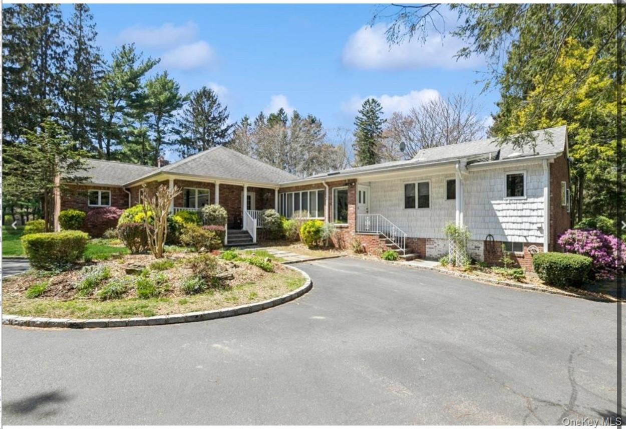 1926 Midlane Road Syosset, NY 11791 - Photo 2 of 21 a view of a house with backyard and sitting area