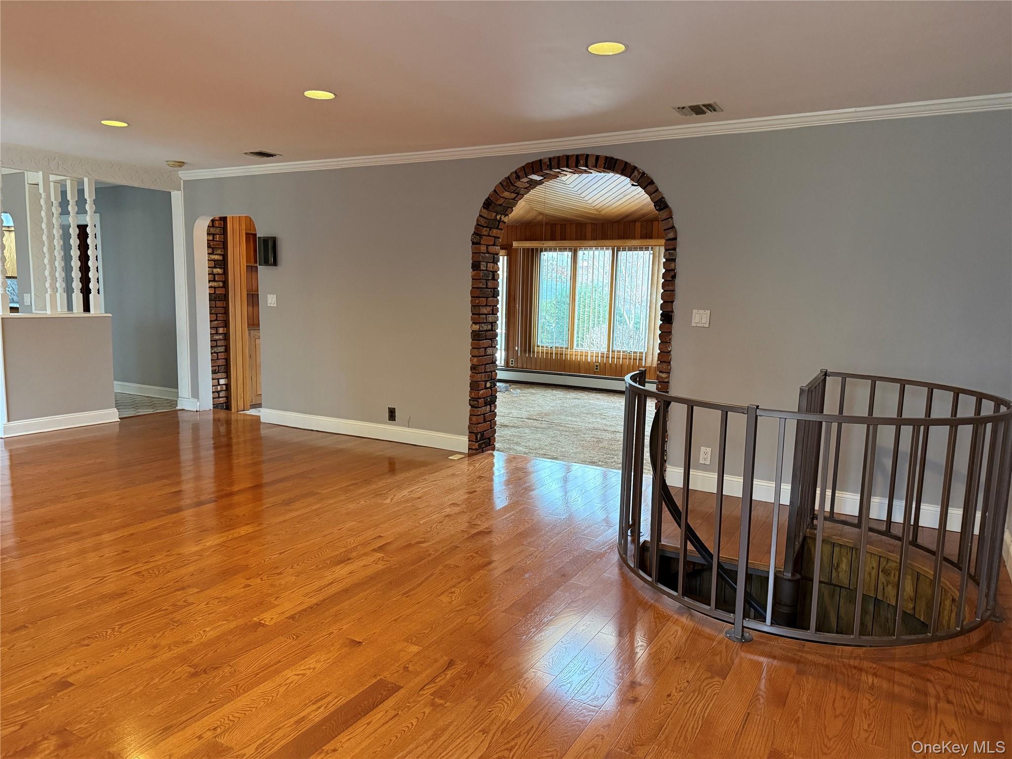 1926 Midlane Road Syosset, NY 11791 - Photo 10 of 21 a view of entryway with wooden floor